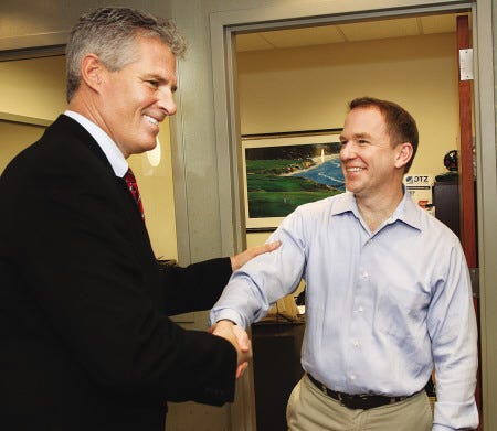 Former Massachusetts Sen. Scott Brown meets with business professionals including Russ Doyle of Two International Group, during an informal luncheon at the Pease International Tradeport in Portsmouth recently.
