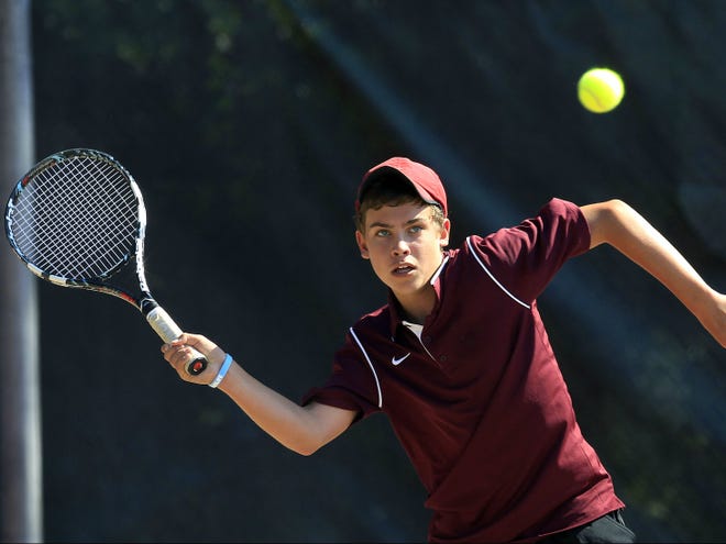 Oak Hall's No. 1 singles player Grey Cacciatore looks to return a volley during Thursday's Class 1A regional final against Jacksonville Episcopal.