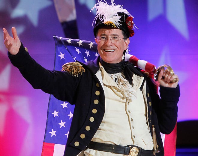 Stephen Colbert, host of "The Colbert Report," on stage during StePhest Colbchella '012 Rocktaugustfest at the Intrepid Sea, Air & Space Museum in New York on Aug. 10, 2012. CBS announced Thursday that Colbert will succeed David Letterman as the host of “The Late Show.”