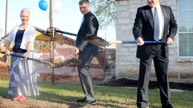 Don Quick & Associates, Inc. kicked off the expansion of the company office space with a groundbreaking ceremony on April 4, with Round Rock Chamber of Commerce officials on-hand. The event took place at 1000 N. Interstate 35 in Round Rock. Pictured: Quick (right) leads the ceremonial groundbreaking.