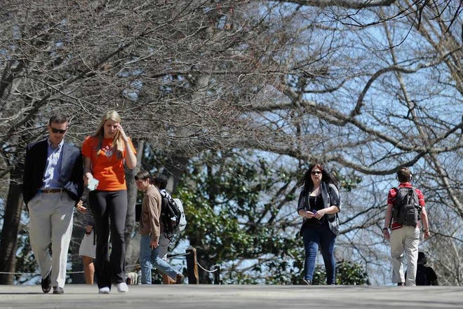 Students walks on the campus of the University of Georgia in Athens, Ga., Thursday, March 21, 2014. (AJ Reynolds/Staff, @ajreynoldsphoto)