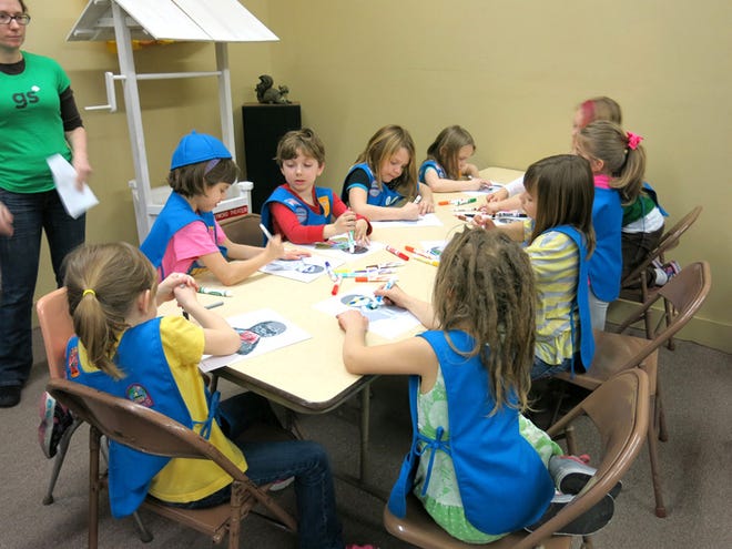 These Chillicothe Daisy Girl Scouts work on an activity during one of their meetings. Lee Breeggemann and Samantha Forsythe lead Troop 4559.