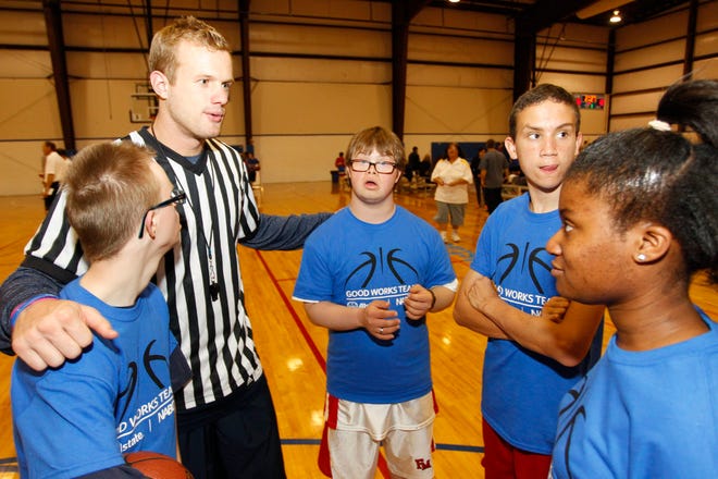 Grant Neil, second from left, and the 2014 Allstate NABC Good Works Team and former NBA player Grant Hill coached Special Olympics Texas athletes in a basketball camp Sunday, April 6, 2014. (Photo/Richard W. Rodriguez)