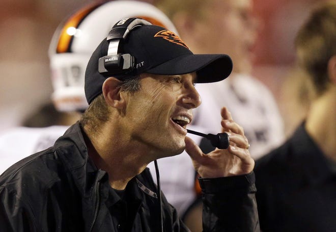 Oregon State head coach Mike Riley shouts to his team in the second quarter during an NCAA college football game against Utah Saturday, Sept. 14, 2013, in Salt Lake City. (AP Photo/Rick Bowmer)