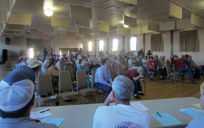 A crowd listens to a meeting discussing water issues Thursday in Montague.