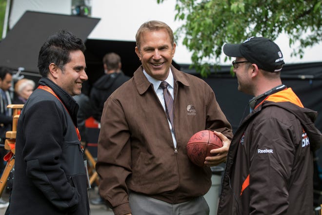 This image released by Summit Entertainment shows Rajiv Joseph, left, Kevin Costner, center, and Scott Rothman in a scene from "Draft Day."