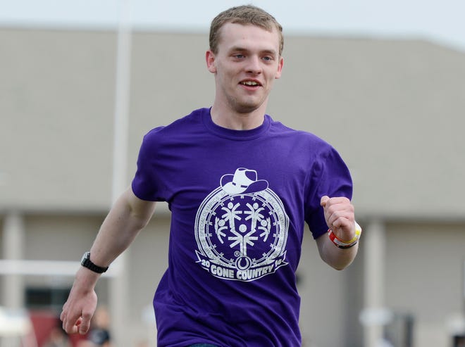 Nikolas Parton competes in the 200 meter run at the Etowah County Special Olympics at Gadsden City High School in Gadsden, Ala. on April 11, 2014.