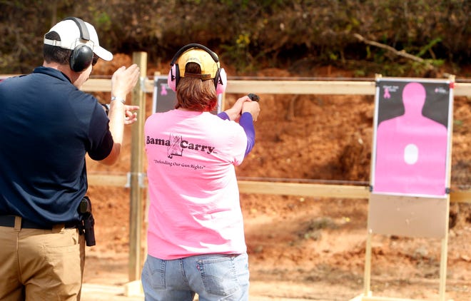 Officer Lachlan Chronister instructs Kathleen Crawford during the Ladies Basic Handgun class by Havoc Shooting Solutions LLC Saturday, April 5 , 2014. Michelle Lepianka Carter | The Tuscaloosa News