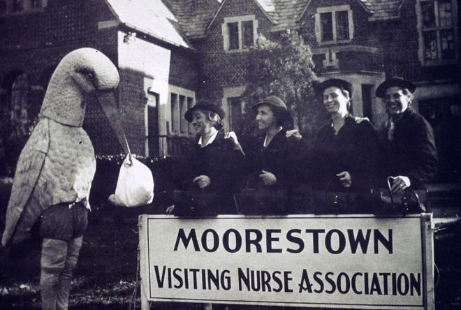 Moorestown VNA nurses and a friend outside the Community House, circa 1940s