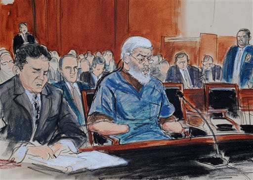 FILE- In this Oct. 9, 2013 file courtroom drawing, defense attorney, Jeremy Schneider, left, represents accused terrorist Mustafa Kamel Mustafa, center, in Manhattan federal court, in New York. Jury selection begins Monday, April 14, 2014, in the New York trial of the Egyptian Islamic preacher extradited from Great Britain on charges he conspired to support al-Qaida.