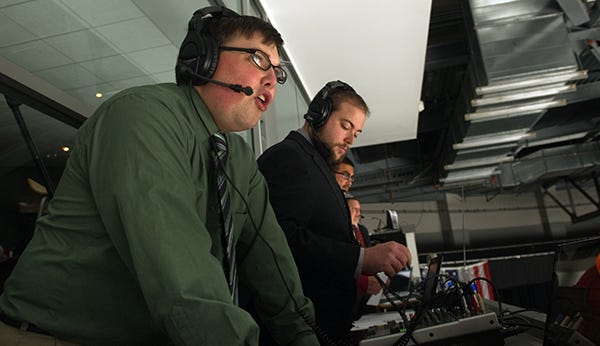Stockton Thunder play-by-play announcer Caleb Lamb, left, calls a game against the Idaho Steelheads at Stockton Arena in downtown Stockton.