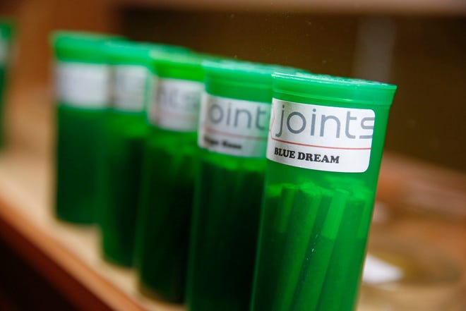 This Dec. 6, 2013 file photo shows different strains of marijuana displayed for sale at The Clinic, a Denver-based dispensary with several outlets, in Denver.