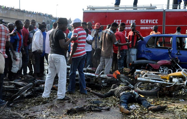 People gather at the site of a blast at the Nyanya Motor Park, about 16 kilometers (10 miles) from the center of Abuja, Nigeria, Monday, April 14, 2014. An explosion blasted through a busy commuter bus station on the outskirts of Abuja before 7 a.m. (0600 GMT) Monday as hundreds of people were traveling to work. (AP Photo/Gbemiga Olamikan) 
 People gather at the site of a blast at the Nyanya Motor Park, about 16 kilometers (10 miles) from the center of Abuja, Nigeria, Monday, April 14, 2014. An explosion blasted through a busy commuter bus station on the outskirts of Abuja before 7 a.m. (0600 GMT) Monday as hundreds of people were traveling to work. (AP Photo/Gbemiga Olamikan) 
 Rescue workers work to recover victims at the site of a blast at the Nyanya Motor Park, about 16 kilometers (10 miles) from the center of Abuja, Nigeria, Monday, April 14, 2014. An explosion blasted through a busy commuter bus station on the outskirts of Abuja before 7 a.m. (0600 GMT) Monday as hundreds of people were traveling to work. (AP Photo/Gbemiga Olamikan)