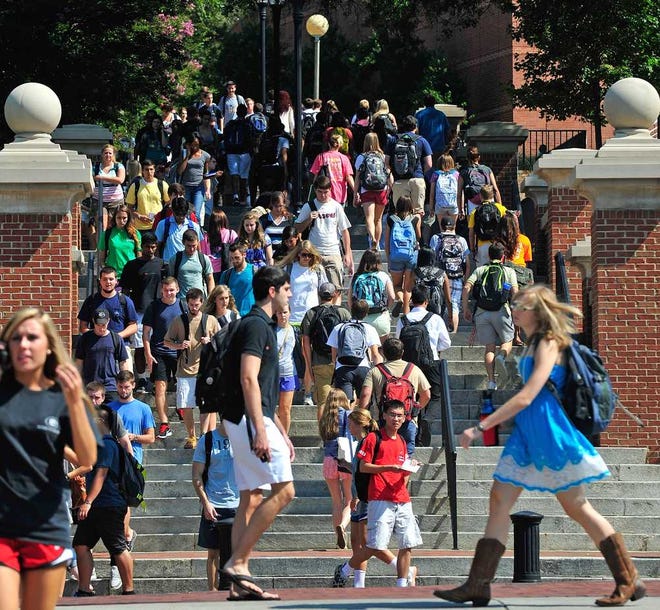 Students descend the hill from North Campus during the first day of classes for the fall semester at the University of Georgia on Monday, Aug. 13, 2012 in Athens, Ga. Richard Hamm/Staff