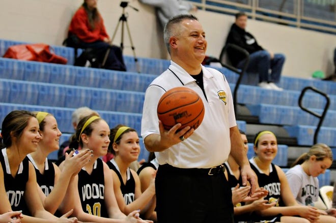 Archbishop Wood High School girls basketball coach Jim Ricci smiles as he catches a loose basketball during the Blue Chip Basketball's 10th Annual Super Sunday Showcase at Spring-ford High School in Royersford Sunday, Jan. 27, 2013. Archbishop Wood beat Bishop McNamara 53-30.
