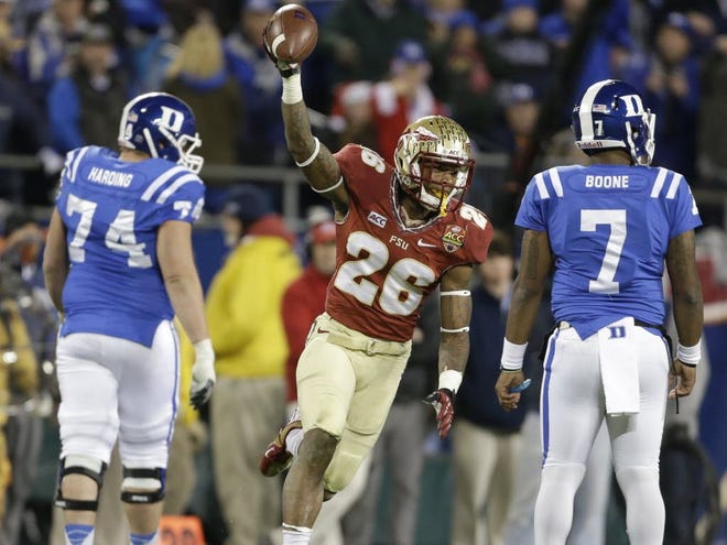 Florida State's P.J. Williams , a Vanguard grad, celebrates his fumble recovery as Duke's Anthony Boone (7) and Dave Harding (74) walk off the field in the second half of the Atlantic Coast Conference Championship NCAA football game in Charlotte, N.C., Saturday, Dec. 7, 2013. Williams impressed during FSU's spring game this past Saturday, recording five tackles, two passes defended and a forced fumble that he recovered.