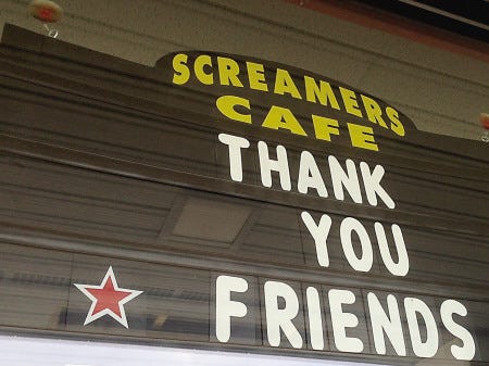 The sign on the window at Screamers Cafe in Stratham on Monday afternoon.