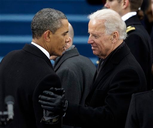 President Barack Obama speaks to Vice President Joe Biden on the West Front of the Capitol in Washington, D.C., on Jan. 21, 2013, following their ceremonial swearing-in during the 57th Presidential Inauguration.