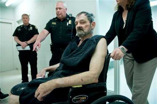 Frazier Glenn Cross, also known as Frazier Glenn Miller, appears at his arraignment in New Century, Kan., Tuesday, April 15, 2014. Cross is being charged for shootings that left three people dead at two Jewish community sites in suburban Kansas City on April 13. At right is Michelle Durrett, attorney with the public defender's office.