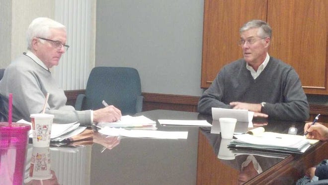 Topeka Citizens Government Review Committee chairman Jim Reardon, left, takes notes during a February interview with former Mayor Doug Wright, who spokes critically of the practice of electing city council members citywide from "at large" districts.