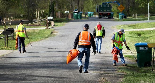 City employees and elected officials in Bessemer City pitched in to clean up the streets Thursday, April 17, 2014.