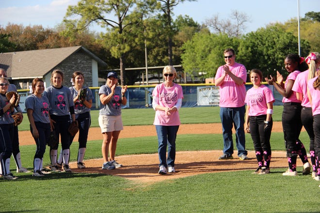 Cancer survivor Camille Cassidy throws out the first pitch at the Fourth Annual Pink Game between Plaquemine and St. John Friday. Both teams wore pink uniforms to promote cancer awareness. Cassidy is the mother of Plaquemine principal Chandler Smith. All proceeds from the game will be donated to “Susan Komen for the Cure.” Plaquemine won 16-8.

POST SOUTH PHOTO/Peter Silas Pasqua