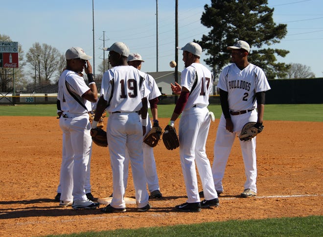 White Castle's Jacory Jones, Dwayne Williams, Tyren Brown, Robert Franklin and Damicah Carter meet before an inning change against Plaquemine earlier in the season. White Castle fell to Ascension Catholic 12-0 on Thursday. 
POST SOUTH PHOTO/Peter Silas Pasqua