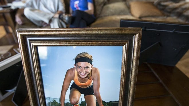 A portrait of former SMU and Lake Travis High sprinter Hannah Moss sits on a living room table as her parents, Logan and Janet Moss, talk about their daughter, who was found dead in her Dallas apartment on March 18. Dallas police said there were no signs of foul play inside Hannah’s apartment, and the cause of the 20-year-old college sophomore’s death remains inconclusive, her parents said.