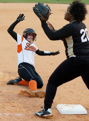 North Davidson's Bre Crumley slides into third safe as Reynolds' Daijah Walker waits for the throw during a recent game.