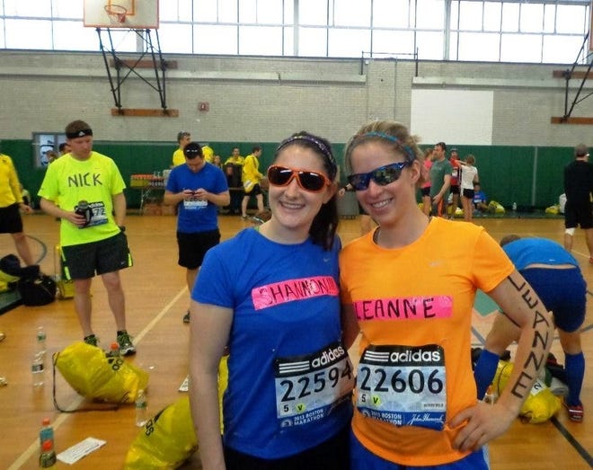 Leanne Rizzitano, right, of Randolph, was stopped halfway to the finish line at last year's marathon. This year, she is running in memory of her cousin who died of cancer. At left is her roommate and running partner, Shannon Murphy.