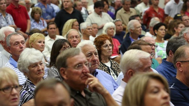 Audience members listen during a public meeting to discuss the proposed All Aboard Florida rail service Thursday, April 17, 2014 at the Jupiter Community Center. (Bruce R. Bennett / The Palm Beach Post)