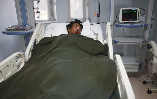 A Nepalese Sherpa Dawa Tashi, who was injured during an avalanche on Mount Everest, gets treatment at a hospital in Katmandu, Nepal, Friday, April 18, 2014.
