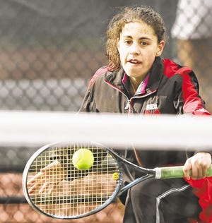 Old Rochester's Julia Nojeim returns to Apponequet's April Locke during their first singles match.