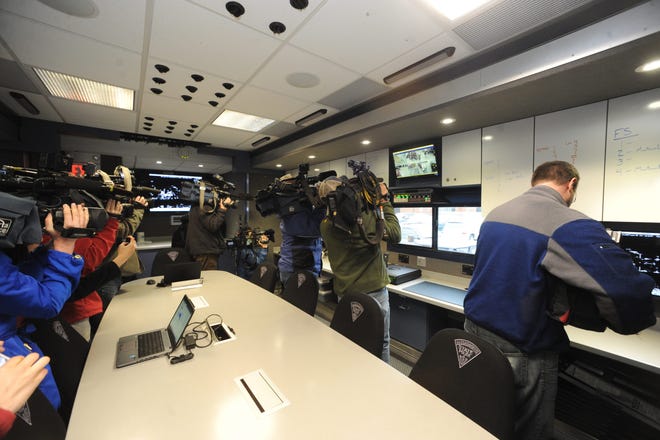 Television news photographers at a press conference inside the Mass. State Police Incident Command Center trailer at Hopkinton High school Friday morning.

Daily News Staff Photo/Art Illman