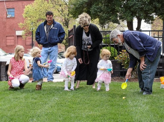 Stephanie Carson
Russell Kvasnicka, the event organizer, teaches kids how to participate in the egg roll race during the craft party and Easter Egg Roll hosted by PAAL on Saturday.