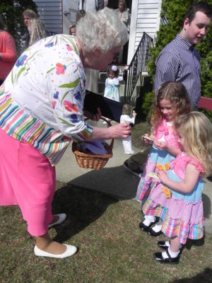 Sandy Dudek shows a figure of Jesus Christ to sisters Whitney and Lucie Stanko, of Griswold, at Preston City Congregational Church on Easter Sunday in Preston. Ryan Blessing The Bulletin
