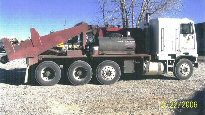 According to investigators, officials at Texas Lone Star Leasing, a Tarrant County company, submitted a doctored photo to the state environmental agency to try to fraudulently obtain more grant money from an emissions reduction program. A truck with an extra axle would qualify the company for more grant money. The company was sentenced to pay a $25,000 fine as part of a July 2013 conviction for a first-degree felony. One company official, convicted of a felony, was ordered to pay $194,610 in restitution to the state and publish a quarter-page apology in the Dallas Morning News, and received five years deferred adjudication. Another official, convicted of a misdemeanor, received two years’ probation. Investigators discovered the unaltered photo on a computer belonging to the defendants upon the execution of a search warrant. PHOTO: TRAVIS COUNTY DISTRICT ATTORNEY’S OFFICE