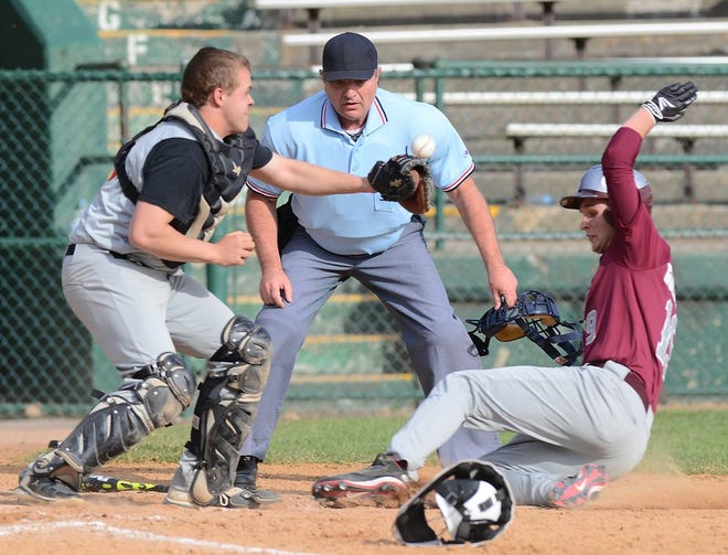 Frankfort-Schuyler's Parker Goldsmith slides in ahead of the tag from Cooperstown catcher Jack Donnelly during Monday's CSC-II baseball game at Cooperstown's Doubleday Field. Frankfort-Schuyler won 11-1.