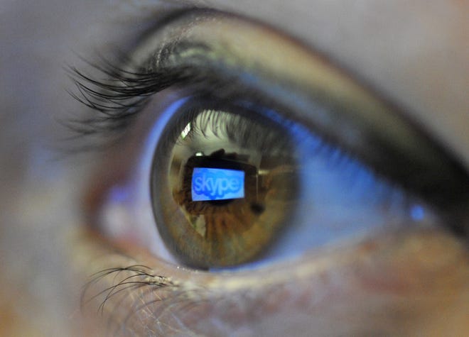 The Skype logo is reflected in the eye of a reader using a smartphone. An Oklahoma doctor was disciplined last year for using Skype to treat patients under his care. Medical board documents in the case showed that Skype is not approved as a telemedicine communication system. AP PHOTO Patrick Sinkel - 
AP