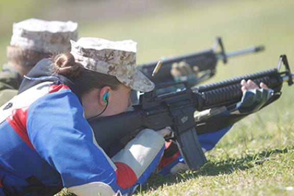 Based in Okinawa and representing the ‘Far East’ team, Cpl. Tracey Moore, 21, shoots during the rifle competition aboard Stone Bay last Wednesday afternoon.