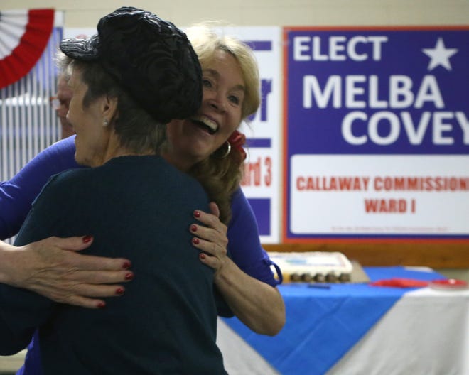 Melba Covey hugs Reeda Thompson at Parker United Methodist Church.