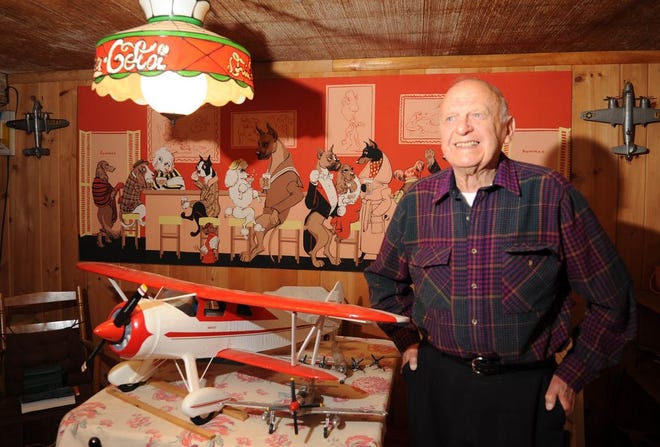 Norman Diegoli, 89, of Middleboro shows off his model of a Waco ‘E’ series airplane.