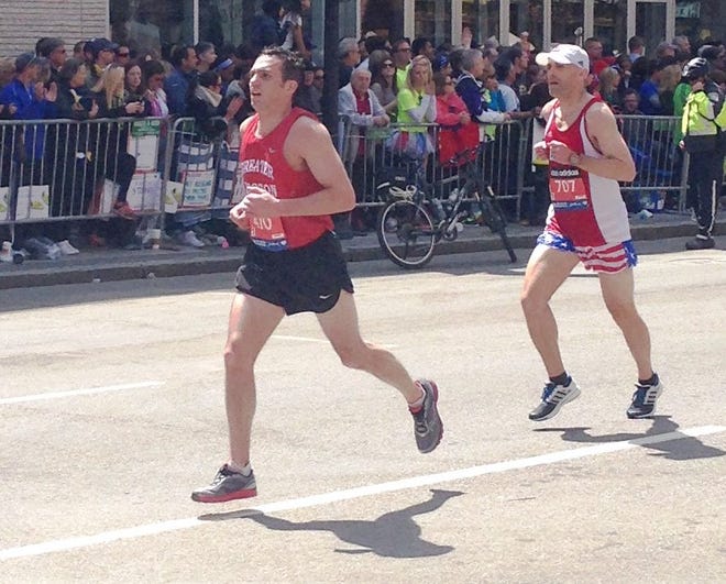 Topsfield's Jason Garrity, in front, nears the Boston Marathon finish line on April 21 to set a personal record time of 2:37:15. Courtesy Photo
