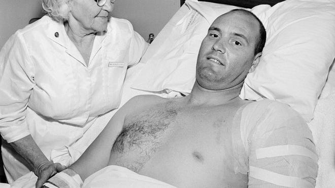 Robert Heard, Associated Press staffer in Austin, Texas, is attended by his nurse, Annie Worley, at Brackenridge Hospital, Aug. 3, 1966, where he is recovering from gunshot wounds suffered while he was covering the shooting spree at the University of Texas tower. Heard was felled by bullets fired by Charles J. Whitman during his rampage.
