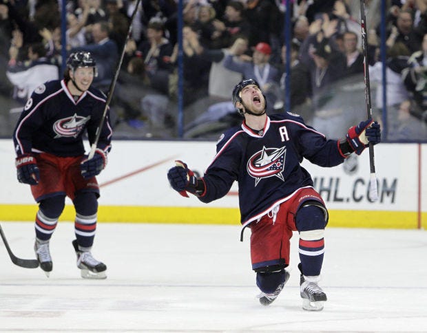 The Blue Jackets' Brandon Dubinsky, right, celebrates his game-tying goal against the Penguins during the third period of Wednesday's Game 4 of a in Columbus, Ohio.