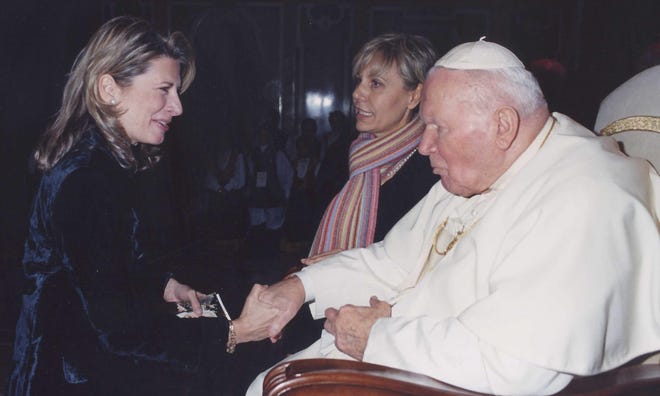 Janet Bedin of Rockford receives a blessing from Pope John Paul II during an audience Dec. 18, 2004, at the Vatican. He died April 5, 2005.