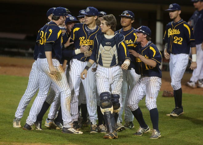 Members of the Burns High baseball team charge on to the field after the final out in a dramatic 2-1 win over South Caldwell in the title game Thursday of the Shelby FCA Easter Tournament at Keeter Stadium/Veterans Field. (Ben Earp photo)