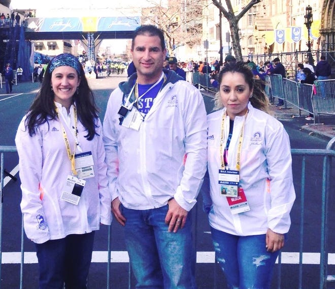 Podiatrist Dr. Scott Aronson of Easton, center, returned to the Boston Marathon this year to treat runners in the medical tent. With Aronson are his associate Dr. Kendra Maher, left, and his medical assistant/office manager Cynthia Contreras, right.

Courtesy photo
