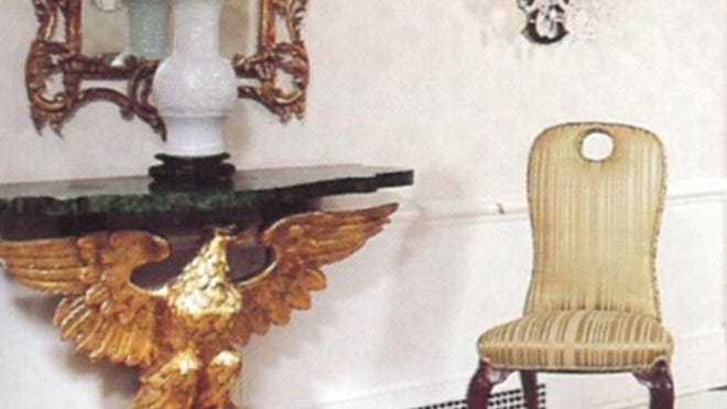 For the design of the entrance to The Greenbrier Suite at The Greenbrier resort in West Virginia, Carleton Varney used a console table with an eagle-shaped base and a malachite top. Photo courtesy of Dorothy Draper & Co.