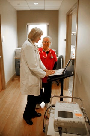 Dr. Sherry Kroll and Medical Assistant Jennifer Stenhouse work together at Day Kimball Healthcare’s Plainfield facility. photos by Francesca Kefalas/ NorwichBulletin.com